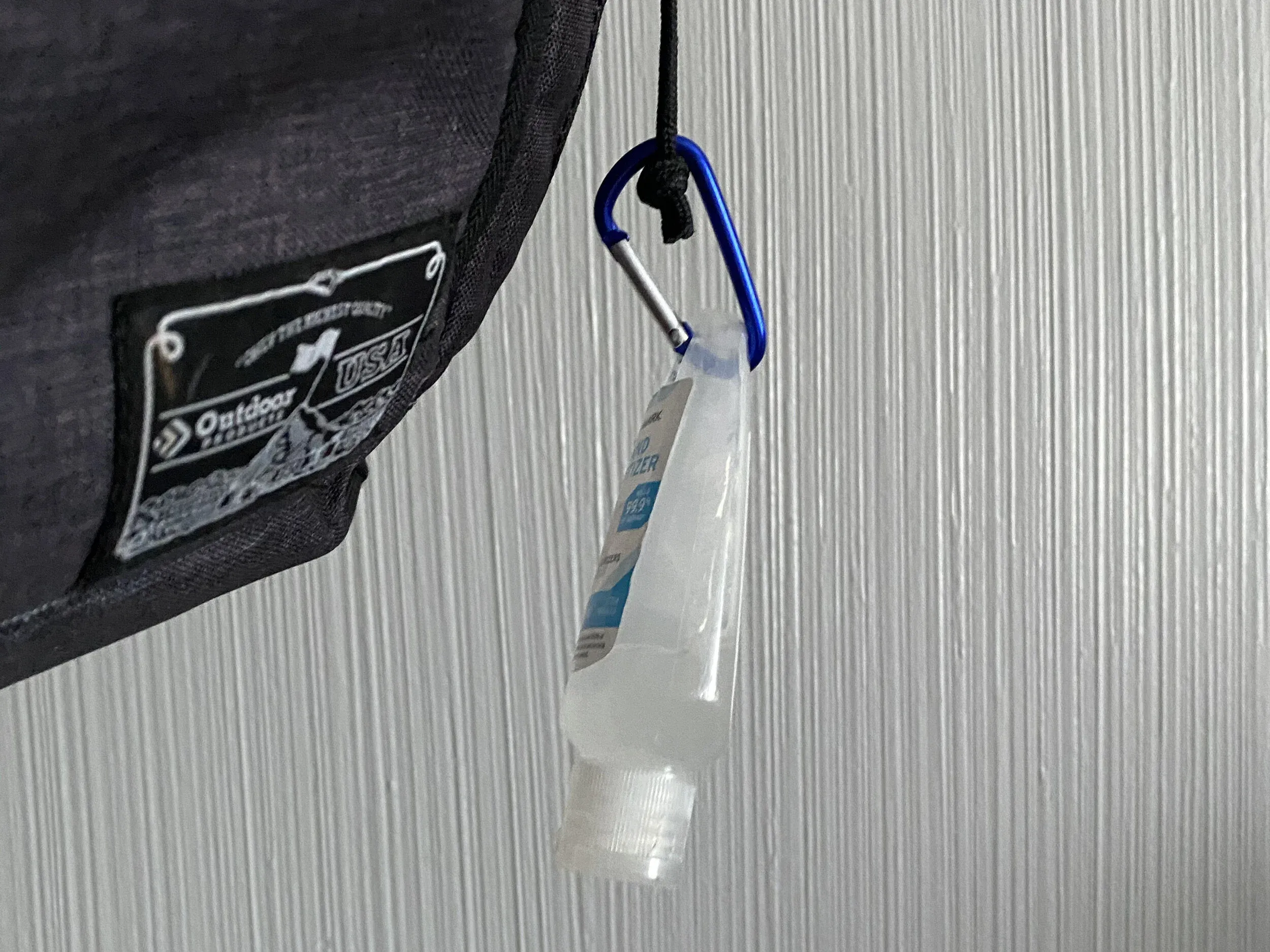 This isn’t the greatest photo, but you can buy hand sanitizer that can be clipped onto a carabiner and attached to your bag for easy access. We highly recommend this.